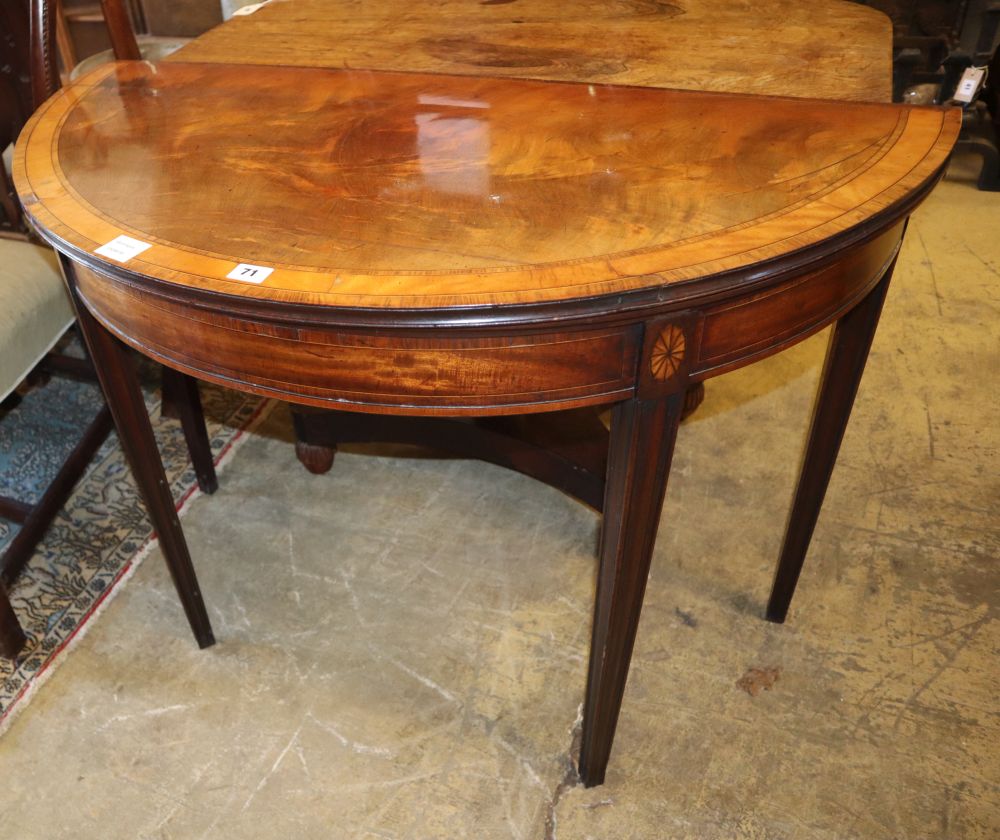 A George III satinwood banded mahogany demi lune folding card table, W.99cm, D.49cm, H.73cm